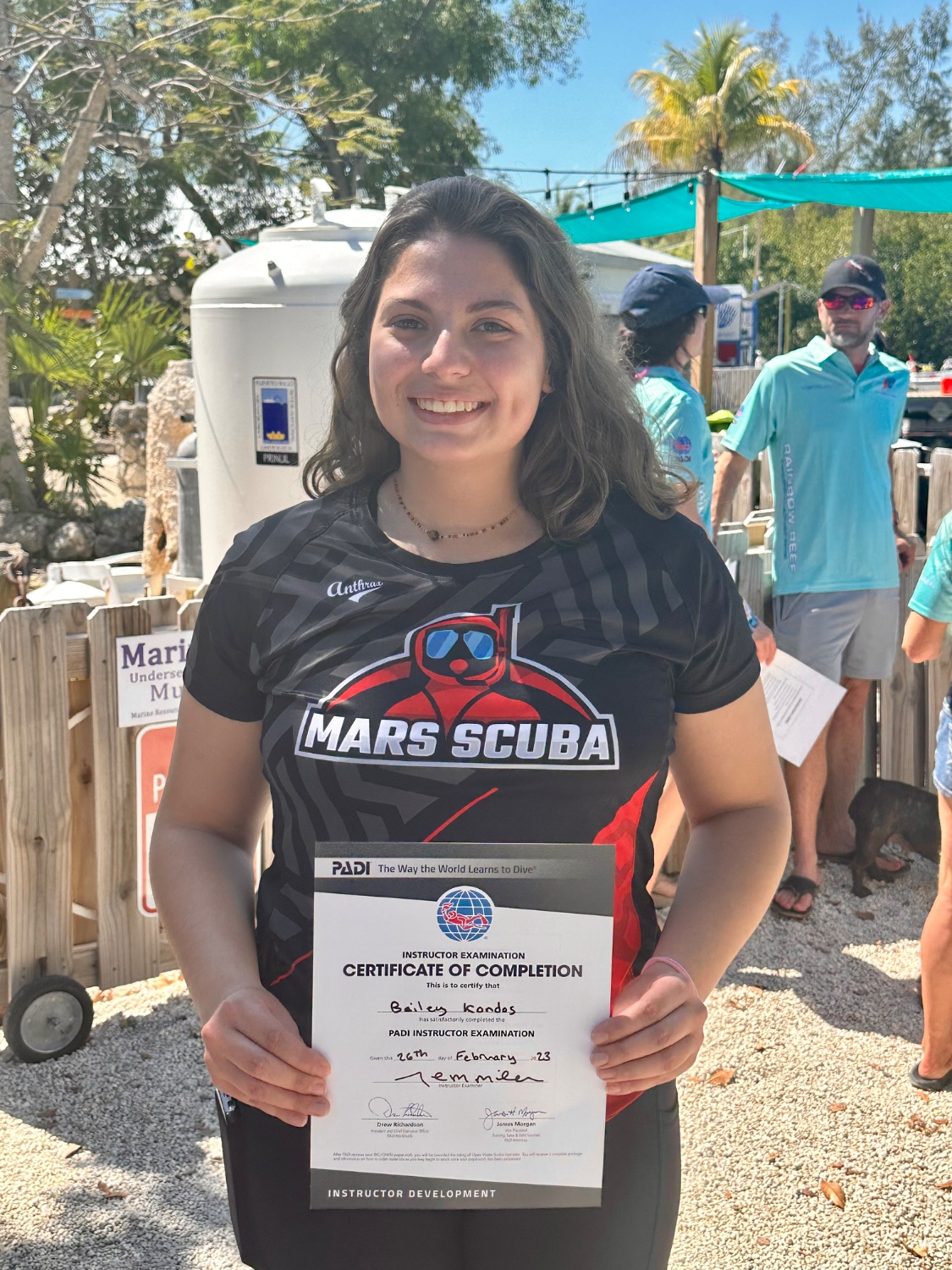Bailey with her PADI Instructor Examination certificate